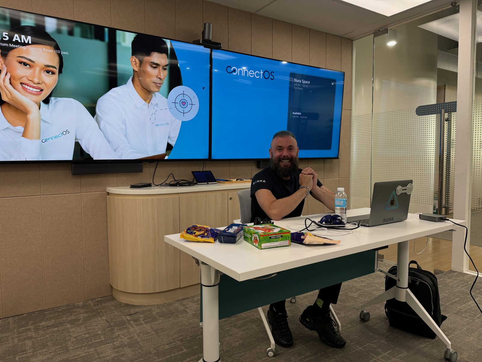 Stephen Aitken at the front of a corporate training room